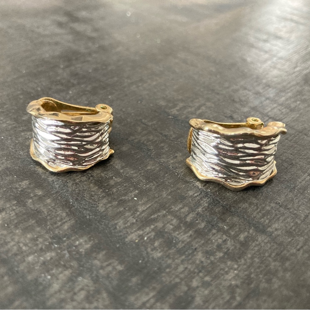 Vintage texture Huggie hoop silver and gold tone metal clip on earrings.